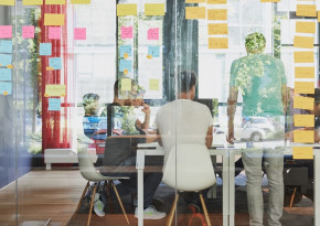 Coworkers sitting at a meeting room in an office