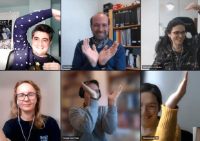 Cocomore team members attempting to make a heart with their arms in a videocall