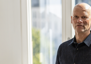 Matthias Schäfer, our CCO is standing in front of a window.