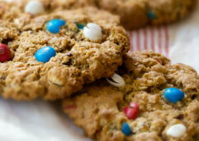 3 cookies topped with colorful candy-coated chocolates
